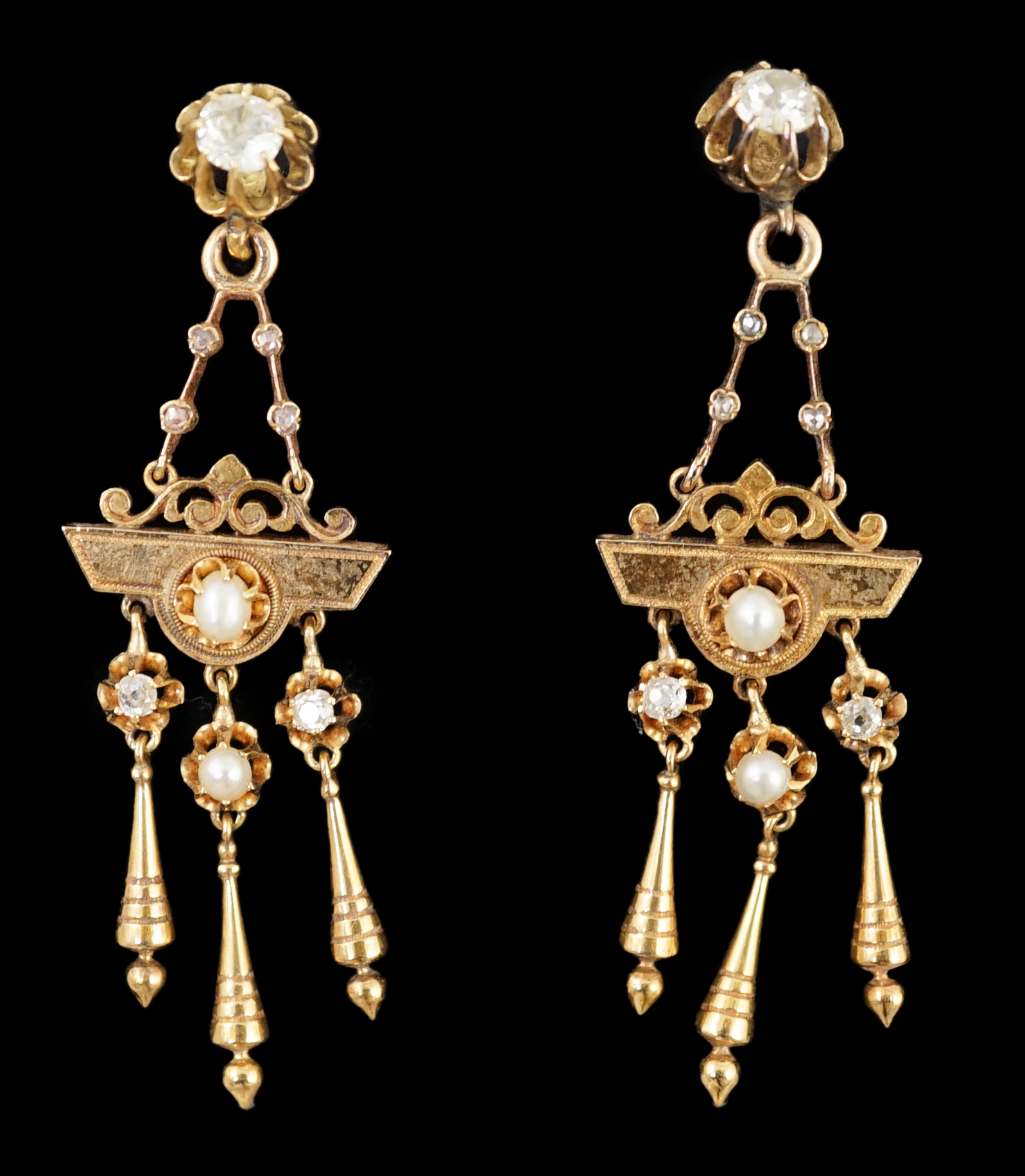 A pair of Victorian gold, seven stone diamond and two stone pearl set triple drop earrings, of aesthetic design